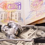 Medical still life with stethoscope, money and passport.