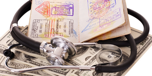 Medical still life with stethoscope, money and passport.