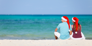 Young couple on Christmas beach vacation