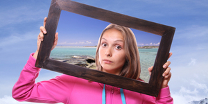 Woman Holding Frame, travel concept