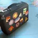 Vintage suitcase over world map