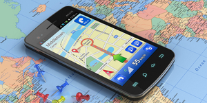 Smartphone with GPS navigation on world map
