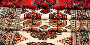 Few handmade carpets with traditional ornament.