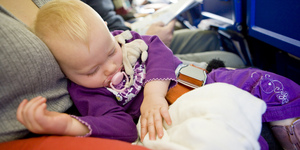 toddler girl sleeping on plane