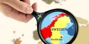 Magnifying glass over a map of Sweden